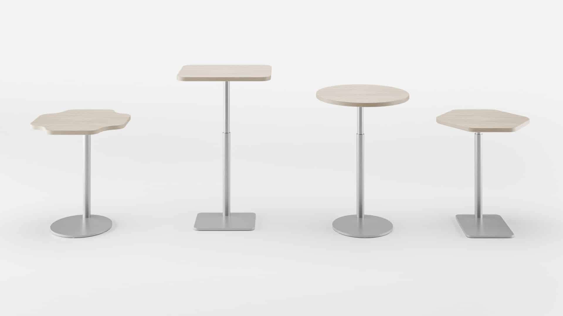 four Retha tables at different adjustable heights